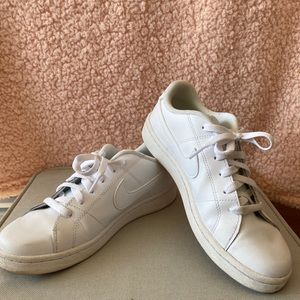Women’s white Nike sneakers